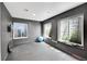 Basement home gym with three windows and gray walls at 5906 S Youngfield Way, Littleton, CO 80127