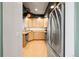 Kitchen features stainless steel appliances, hardwood floors, and plenty of natural light at 5906 S Youngfield Way, Littleton, CO 80127