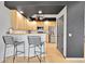 Open kitchen features bar seating, stainless steel appliances, and plenty of counter space at 5906 S Youngfield Way, Littleton, CO 80127