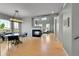 Spacious living room featuring hardwood floors, fireplace, and large windows for natural light at 5906 S Youngfield Way, Littleton, CO 80127
