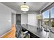 Well-lit office space boasts natural light, hardwood flooring, and practical workspace at 5906 S Youngfield Way, Littleton, CO 80127