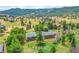 High angle view of a home on a treed lot, showcasing the property's large fenced yard at 323 Paradise Rd, Golden, CO 80401