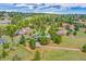 Scenic aerial view showcasing homes surrounded by lush green trees, highlighting a peaceful neighborhood at 323 Paradise Rd, Golden, CO 80401
