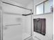 Modern bathroom with glass-enclosed shower and tiled walls, plus towel rack at 323 Paradise Rd, Golden, CO 80401