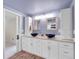Stylish bathroom with double sinks, wood cabinets, and decorative lighting at 323 Paradise Rd, Golden, CO 80401