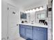 Stylish bathroom with double vanity, blue cabinets, and modern fixtures at 323 Paradise Rd, Golden, CO 80401