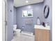 Cozy bathroom featuring a vanity, toilet, and a shower with glass doors at 323 Paradise Rd, Golden, CO 80401