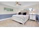 Cozy bedroom with neutral colors, a comfortable bed, and natural light from the window at 323 Paradise Rd, Golden, CO 80401