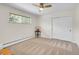 Simple bedroom with carpet, a window, a ceiling fan, and a double closet at 323 Paradise Rd, Golden, CO 80401