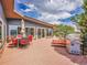 Spacious deck featuring outdoor seating, a grill, and sliding glass doors leading inside, perfect for entertaining at 323 Paradise Rd, Golden, CO 80401