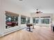 Bright office space featuring large windows, a ceiling fan, and wood flooring at 323 Paradise Rd, Golden, CO 80401