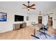 Well-lit home office with a modern desk, ceiling fan, and hardwood floors at 323 Paradise Rd, Golden, CO 80401