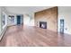 Inviting living room with stone fireplace, hardwood floors, and bright windows at 323 Paradise Rd, Golden, CO 80401