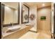 Spa-like bathroom with double sinks, a soaking tub, and a walk-in shower at 975 N Lincoln St # 15A, Denver, CO 80203