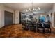 Open concept dining room with dark wood floors and modern kitchen at 975 N Lincoln St # 15A, Denver, CO 80203