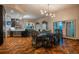 Elegant dining area with a large table and access to a modern kitchen at 975 N Lincoln St # 15A, Denver, CO 80203