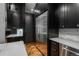 Modern kitchen with stainless steel appliances and marble countertops at 975 N Lincoln St # 15A, Denver, CO 80203