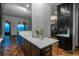 Modern kitchen with marble countertops and dark cabinetry at 975 N Lincoln St # 15A, Denver, CO 80203