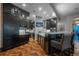 Gourmet kitchen with island seating and high-end appliances at 975 N Lincoln St # 15A, Denver, CO 80203