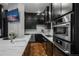 Luxury kitchen with stainless steel appliances and marble countertops at 975 N Lincoln St # 15A, Denver, CO 80203