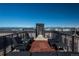 Relaxing rooftop deck with city views, seating, and modern decor at 975 N Lincoln St # 15A, Denver, CO 80203