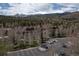 Aerial view of complex with snow capped mountains in the background at 34 Highfield Trl # 311, Breckenridge, CO 80424