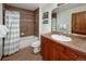 Well-appointed bathroom with a tiled shower, vanity with sink, and a decorative mirror at 34 Highfield Trl # 311, Breckenridge, CO 80424