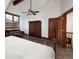 Bedroom features a vaulted ceiling, closet, hardwood floors, and a window with views at 34 Highfield Trl # 311, Breckenridge, CO 80424