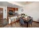Kitchen with wooden cabinets, granite counters, stainless appliances, and an eat-in breakfast bar at 34 Highfield Trl # 311, Breckenridge, CO 80424