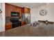 Well-lit kitchen featuring stainless steel appliances and wooden cabinetry with granite countertops at 34 Highfield Trl # 311, Breckenridge, CO 80424