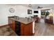 Kitchen featuring wooden cabinets, granite countertops, and open layout connected to the living area at 34 Highfield Trl # 311, Breckenridge, CO 80424