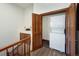 Upstairs laundry area with a stacked washer and dryer and wood door at 34 Highfield Trl # 311, Breckenridge, CO 80424