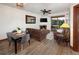 Open-concept living room and dining area with a fireplace and access to the private deck at 34 Highfield Trl # 311, Breckenridge, CO 80424