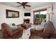 Inviting living room featuring a cozy fireplace, plush seating, and a sliding glass door to a deck at 34 Highfield Trl # 311, Breckenridge, CO 80424