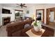 Cozy living room with fireplace next to dining area, creating a warm and inviting space at 34 Highfield Trl # 311, Breckenridge, CO 80424