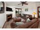 Comfortable living room with a fireplace, TV, cozy furniture, and access to a private deck for outdoor relaxation at 34 Highfield Trl # 311, Breckenridge, CO 80424