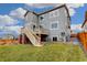 Large backyard featuring a wooden deck and brick column supports at 12917 Fox St, Westminster, CO 80234