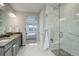 Beautiful bathroom with a glass shower, granite countertops, and access to main bedroom at 12917 Fox St, Westminster, CO 80234