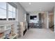 Spacious bonus room with a play kitchen, ample storage, and entertainment center at 12917 Fox St, Westminster, CO 80234