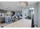 Open floor plan offering a dining room featuring a modern chandelier, and an open staircase at 12917 Fox St, Westminster, CO 80234