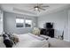 Bright main bedroom with ample natural light, a ceiling fan, and stylish decor at 12917 Fox St, Westminster, CO 80234