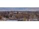 This image showcases the picturesque neighborhood nestled against a backdrop of majestic mountains and distant buildings at 12917 Fox St, Westminster, CO 80234