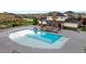 Community pool surrounded by lounge chairs and landscaping at 12917 Fox St, Westminster, CO 80234
