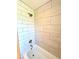 Modern shower with neutral-toned tiles and shower head at 375 Kendall St, Lakewood, CO 80226