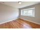 Bedroom featuring hardwood floors, neutral paint, and good natural lighting at 375 Kendall St, Lakewood, CO 80226