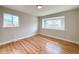 Bedroom featuring hardwood floors, neutral paint, and good natural lighting at 375 Kendall St, Lakewood, CO 80226