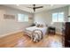 Cozy bedroom with stylish furnishings, warm paint color, and natural light at 375 Kendall St, Lakewood, CO 80226