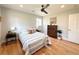 Bedroom featuring ceiling fan, neutral paint, and hardwood floors at 375 Kendall St, Lakewood, CO 80226