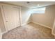Cozy carpeted bedroom with ample natural light, closet, and fresh paint; ideal for relaxation and rest at 375 Kendall St, Lakewood, CO 80226