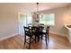 Charming dining space with a sliding door and backyard views, perfect for Gathering meals at 375 Kendall St, Lakewood, CO 80226